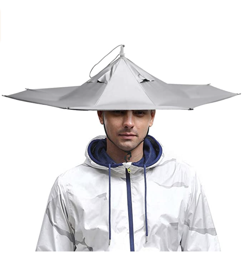 Man in white puffy coat and white Umbrella hat