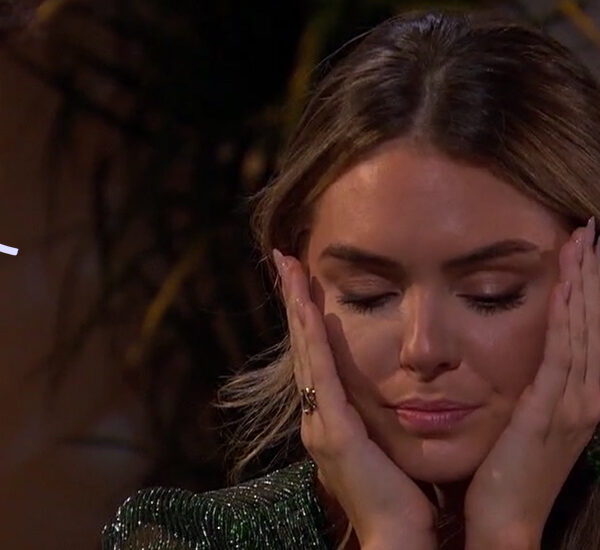 Susie with her head in her hands, looking upset at her fantasy suite date on The Bachelor