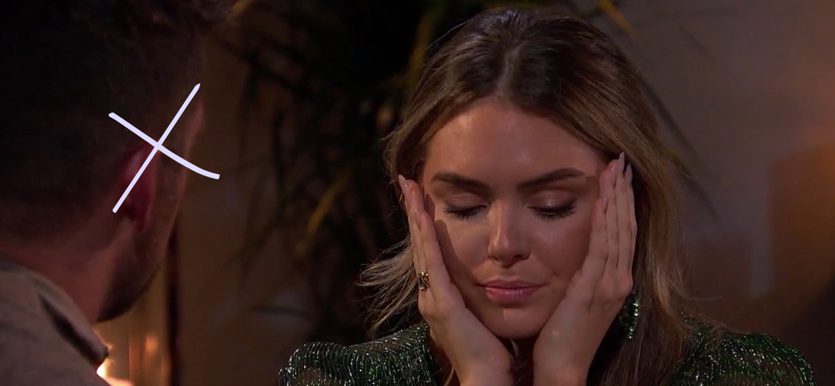 Susie with her head in her hands, looking upset at her fantasy suite date on The Bachelor