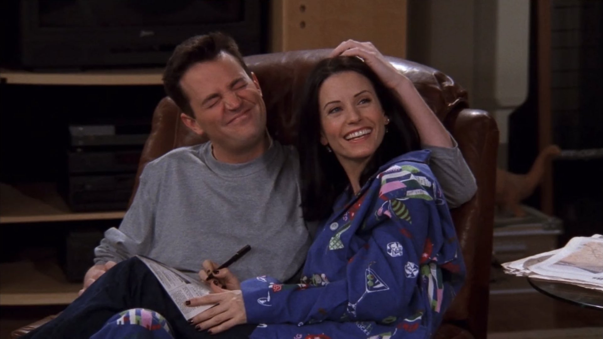 Monica and Chandler snuggle in "Friends"