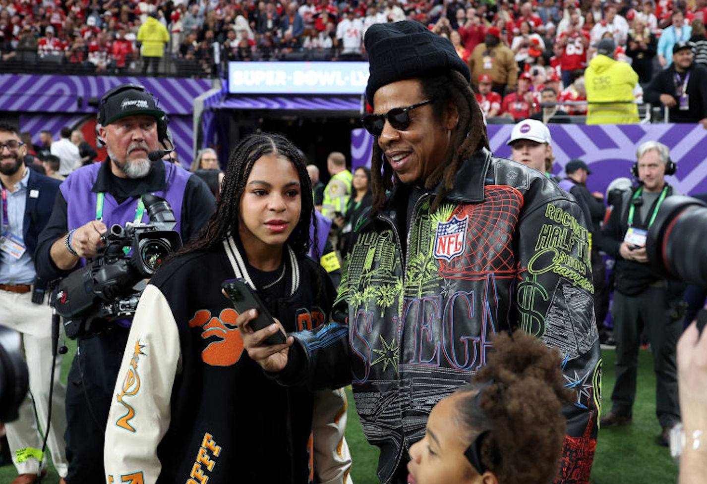 LAS VEGAS, NEVADA - FEBRUARY 11: American Rapper Jay-Z stands on the sidelines with daughter Blue Ivy Carter before Super Bowl LVIII between the against the San Francisco 49ers and Kansas City Chiefs at Allegiant Stadium on February 11, 2024 in Las Vegas, Nevada. (Photo by Ezra Shaw/Getty Images)