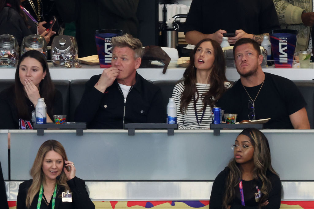 LAS VEGAS, NEVADA - FEBRUARY 11: (L-R) Celebrity chef Gordon Ramsay, actress Minka Kelly, and singer/songwriter Dan Reynolds look on in the first quarter during Super Bowl LVIII between the San Francisco 49ers and Kansas City Chiefs at Allegiant Stadium on February 11, 2024 in Las Vegas, Nevada. (Photo by Rob Carr/Getty Images)
