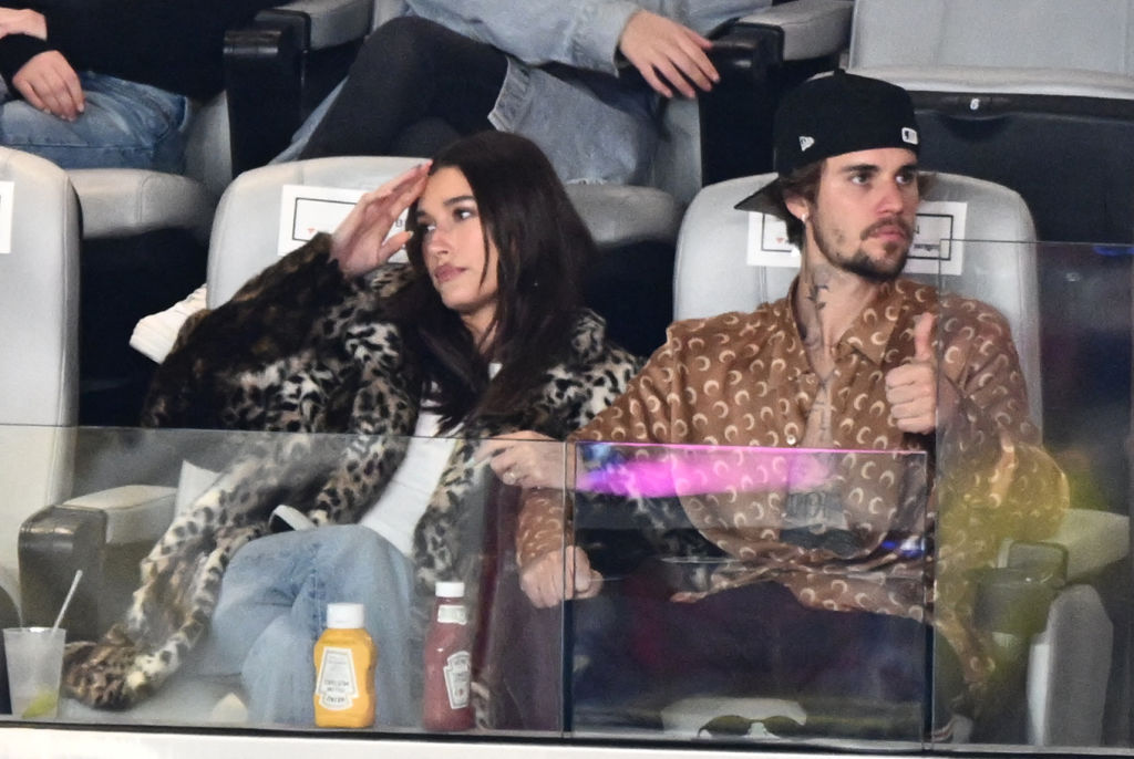 Canadian singer-songwriter Justin Bieber and his wife US model Hailey Bieber watch Super Bowl LVIII between the Kansas City Chiefs and the San Francisco 49ers at Allegiant Stadium in Las Vegas, Nevada, February 11, 2024. (Photo by Patrick T. Fallon / AFP) (Photo by PATRICK T. FALLON/AFP via Getty Images)