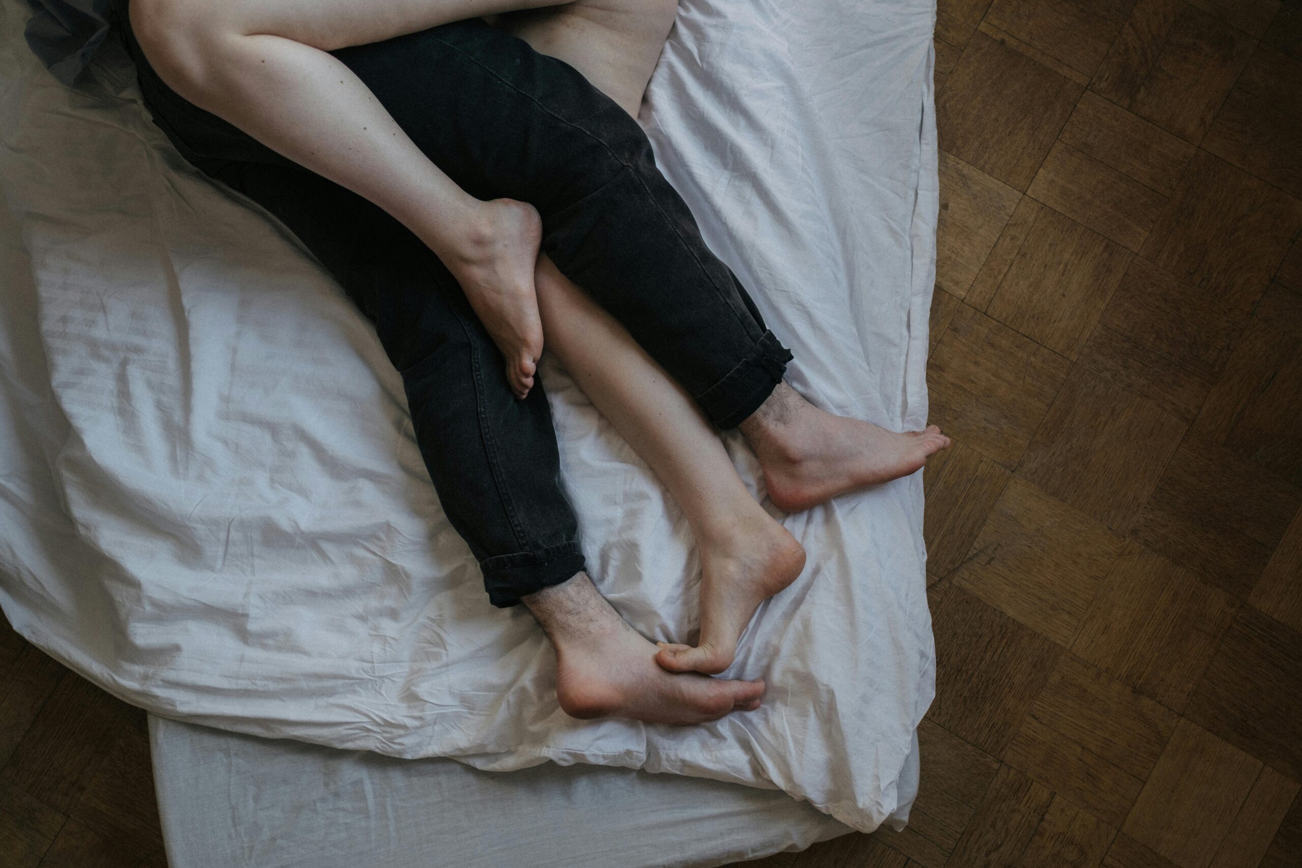 couple's feet in bed