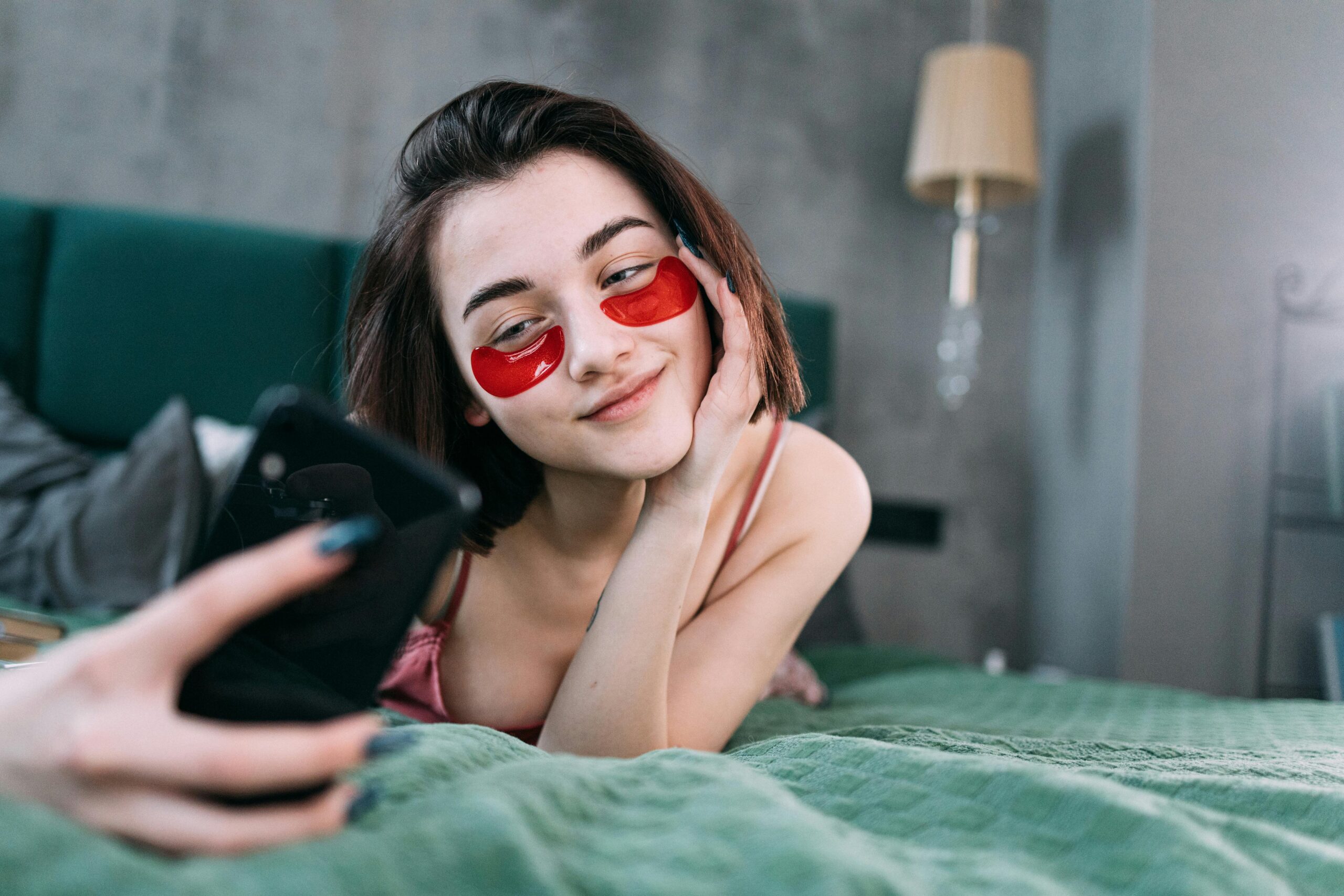 woman in bed with skincare