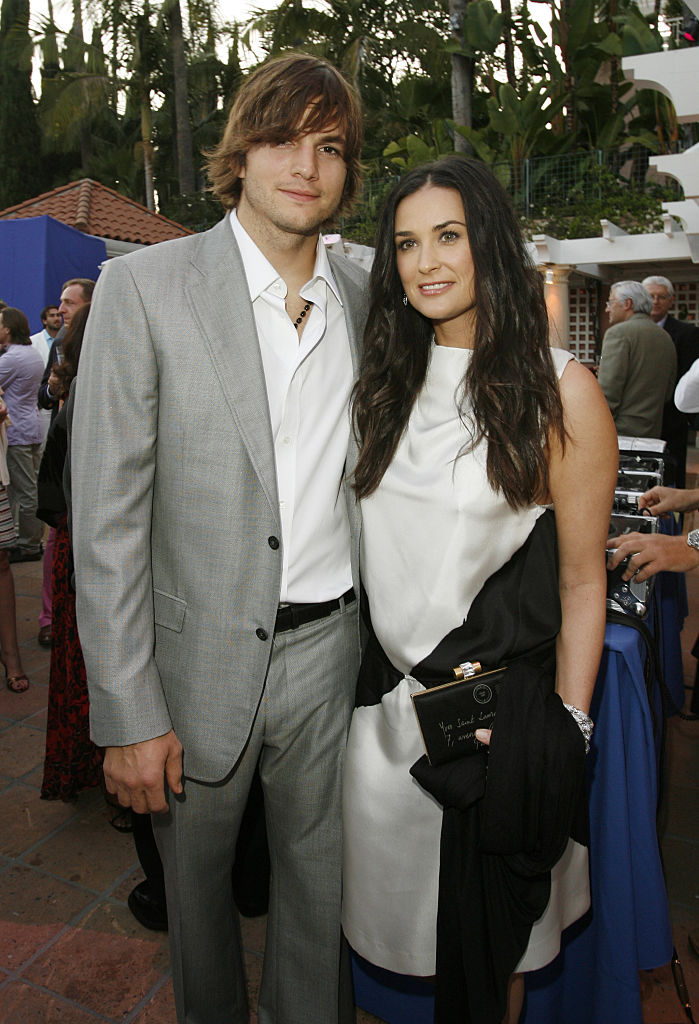 Ashton Kutcher and Demi Moore during Center Dance Art's Pool Party Sponsored by Yves Saint Laurent - Inside Cocktail at Beverly Hills Hotel in Beverly Hills, California, United States. (Photo by Donato Sardella/WireImage)z