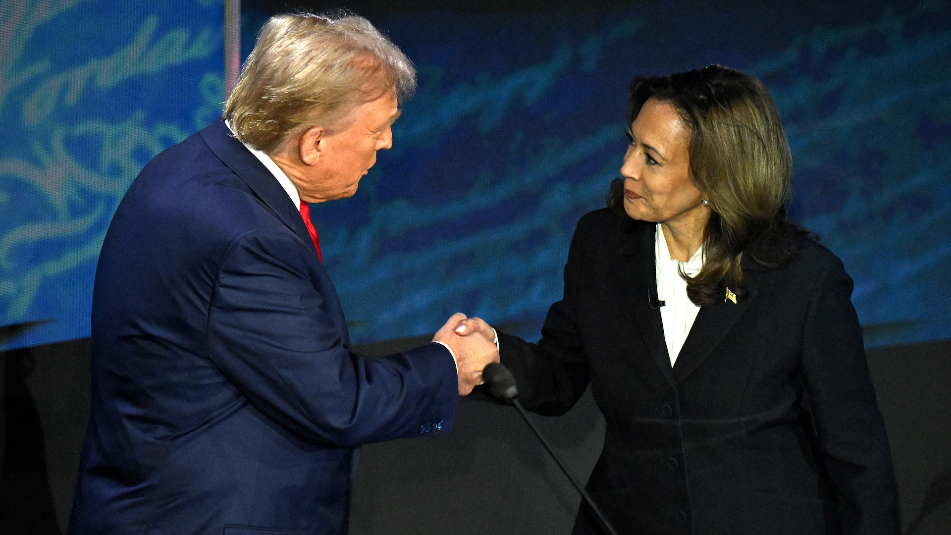 US Vice President and Democratic presidential candidate Kamala Harris (R) shakes hands with former US President and Republican presidential candidate Donald Trump during a presidential debate at the National Constitution Center in Philadelphia, Pennsylvania, on September 10, 2024. (Photo by SAUL LOEB / AFP)