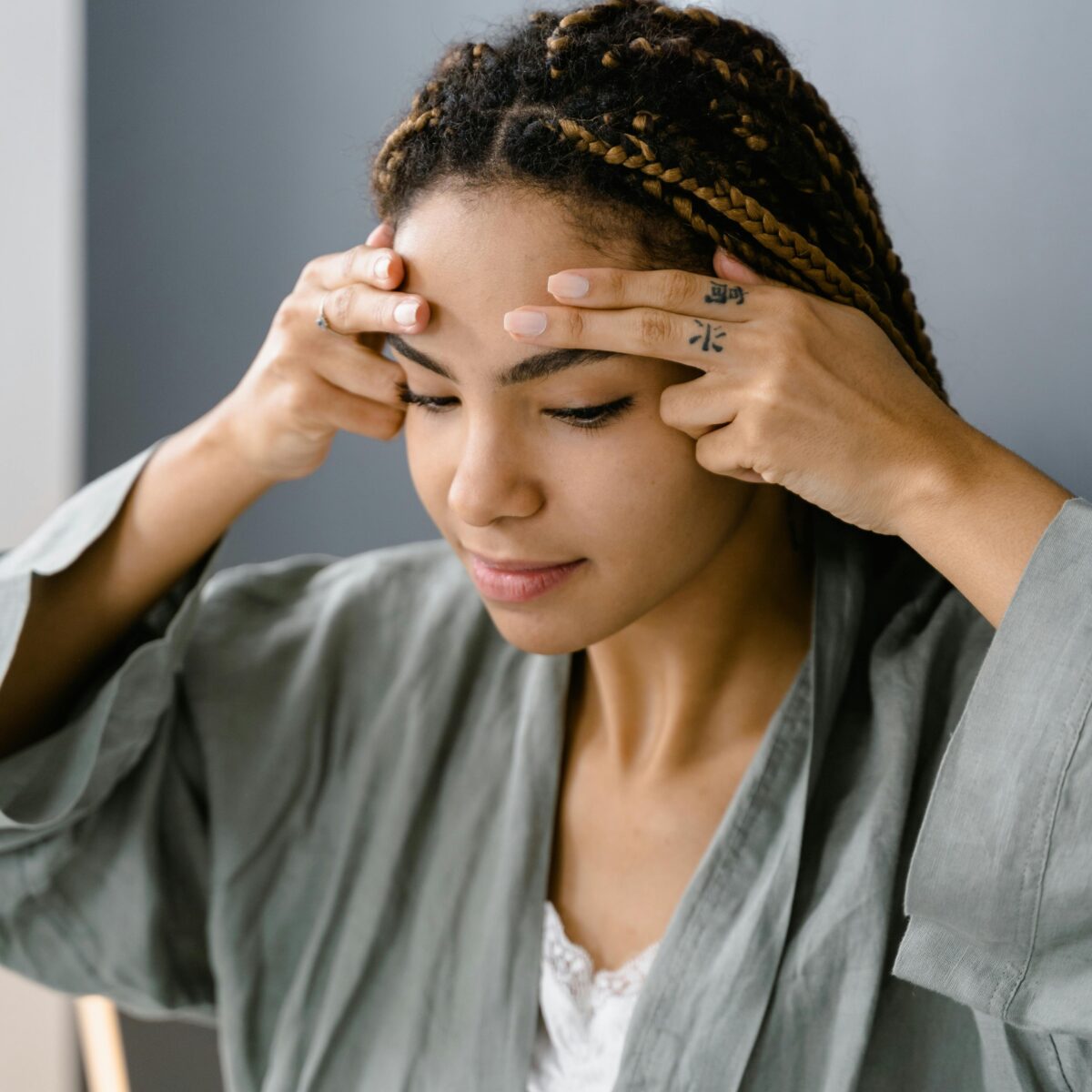 woman touching her face