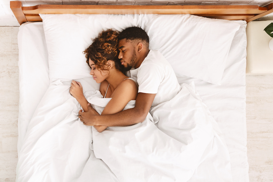 Couple in bed asleep